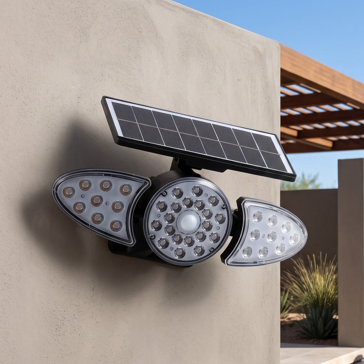 Solar wall light in Three Head on an exterior wall in daylight