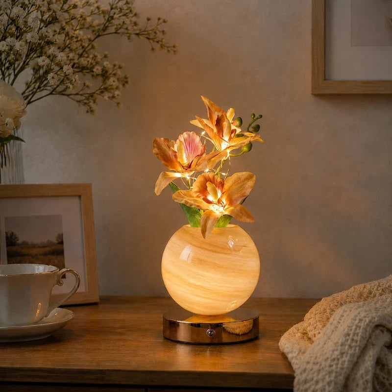 Solna orchid lamp in Champagne on a wood side table