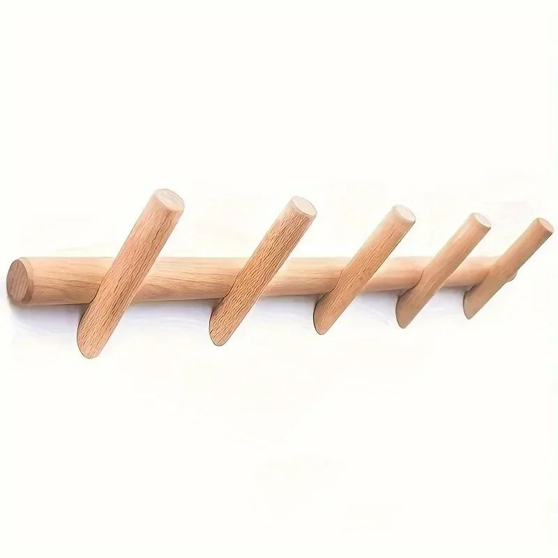 Stord solid oak peg rack with five angled round pegs, on white