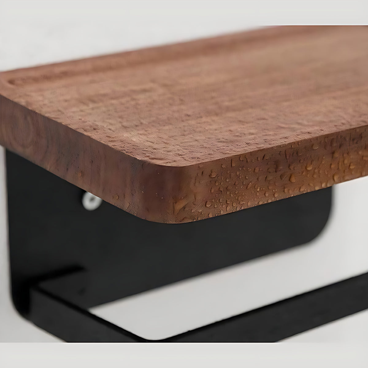 Close view of the bamboo shelf edge and black aluminum bracket