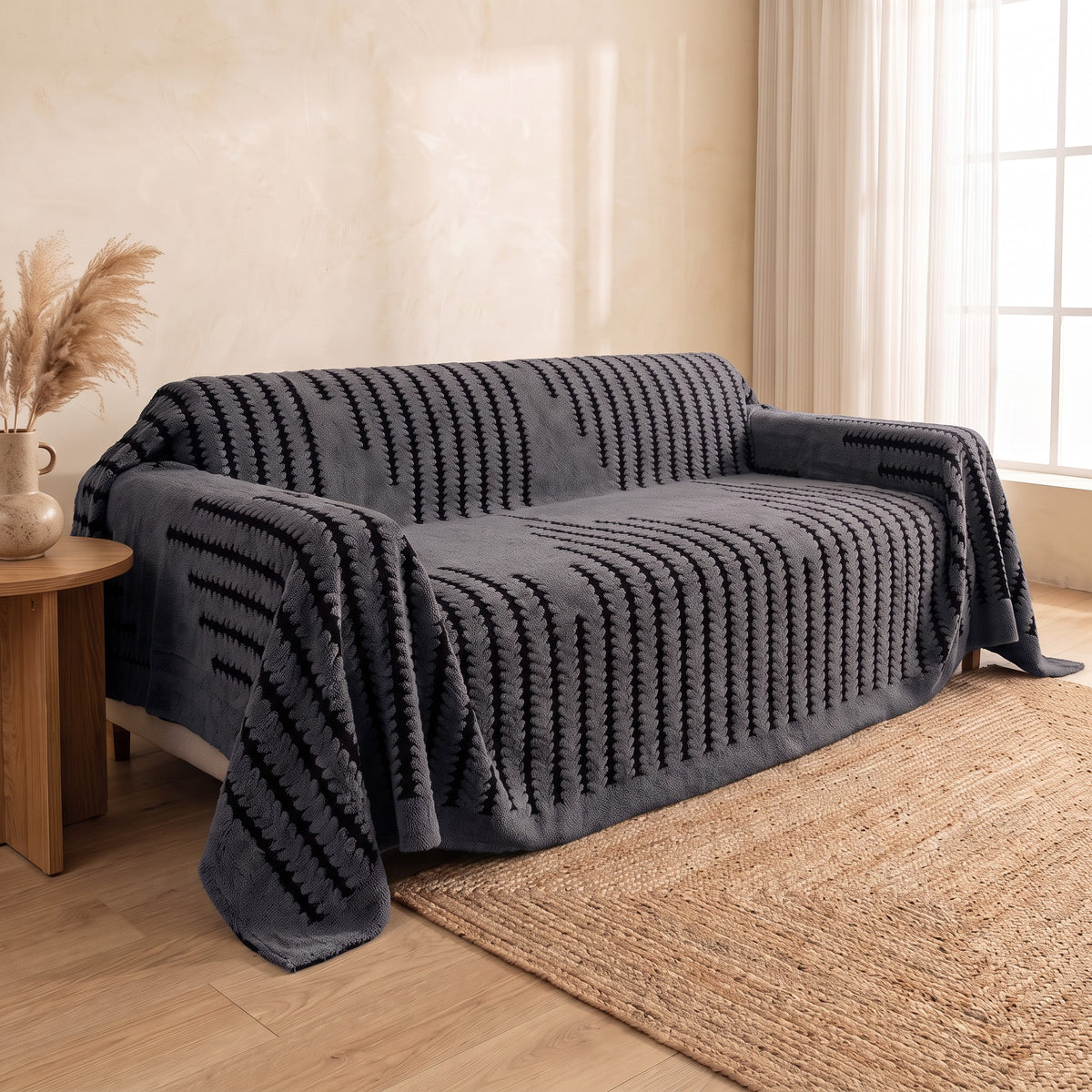 Sofa Cover in Charcoal on a sofa