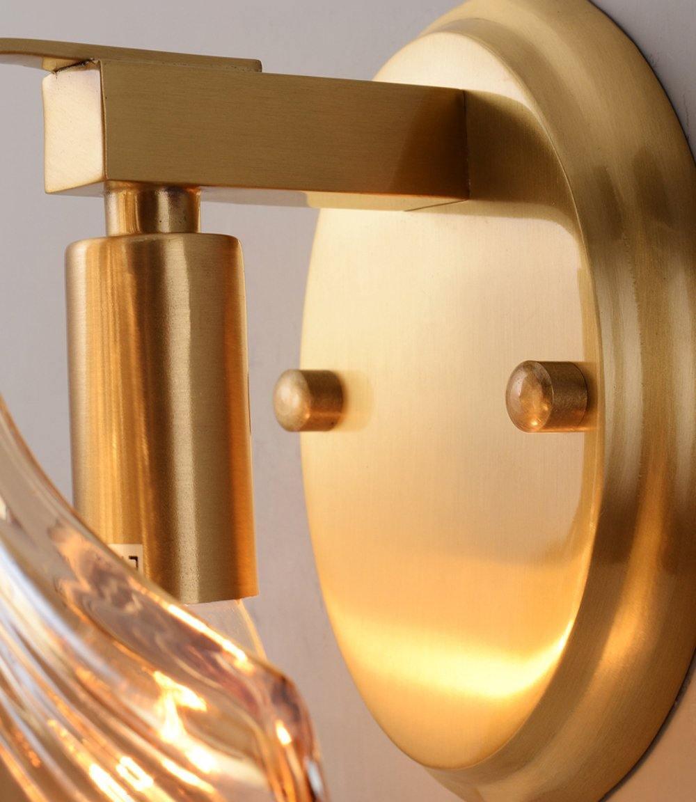Close up of the gold arm and bulb holder inside the shell