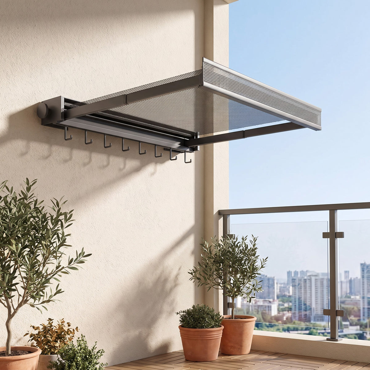 Gray wall drying rack with the mesh shelf pulled out on a balcony wall