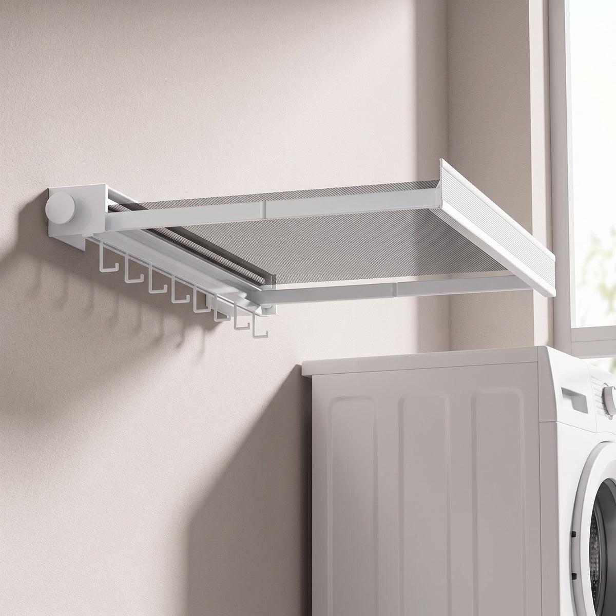 White wall drying rack on a utility room wall beside a washer