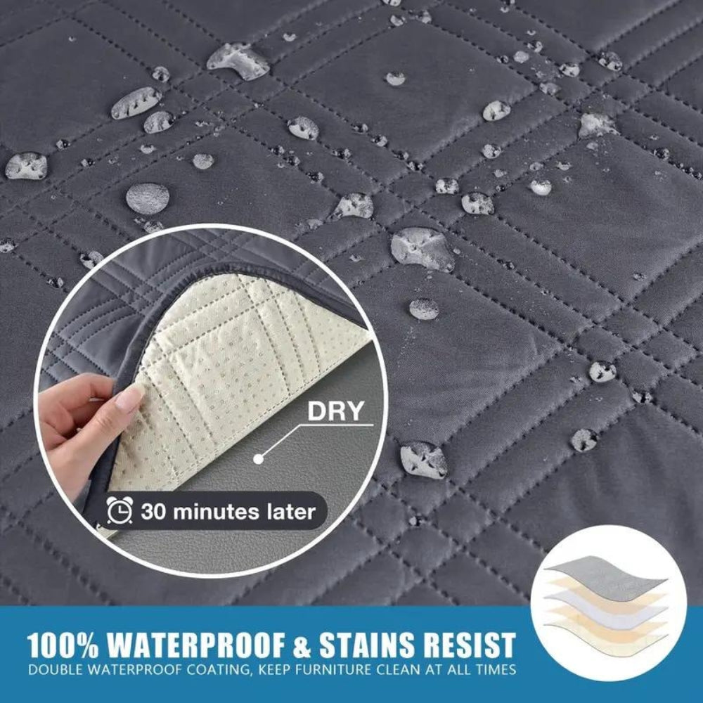 Water drops beading on the dark gray quilted cover with a layer drawing and the dry underside