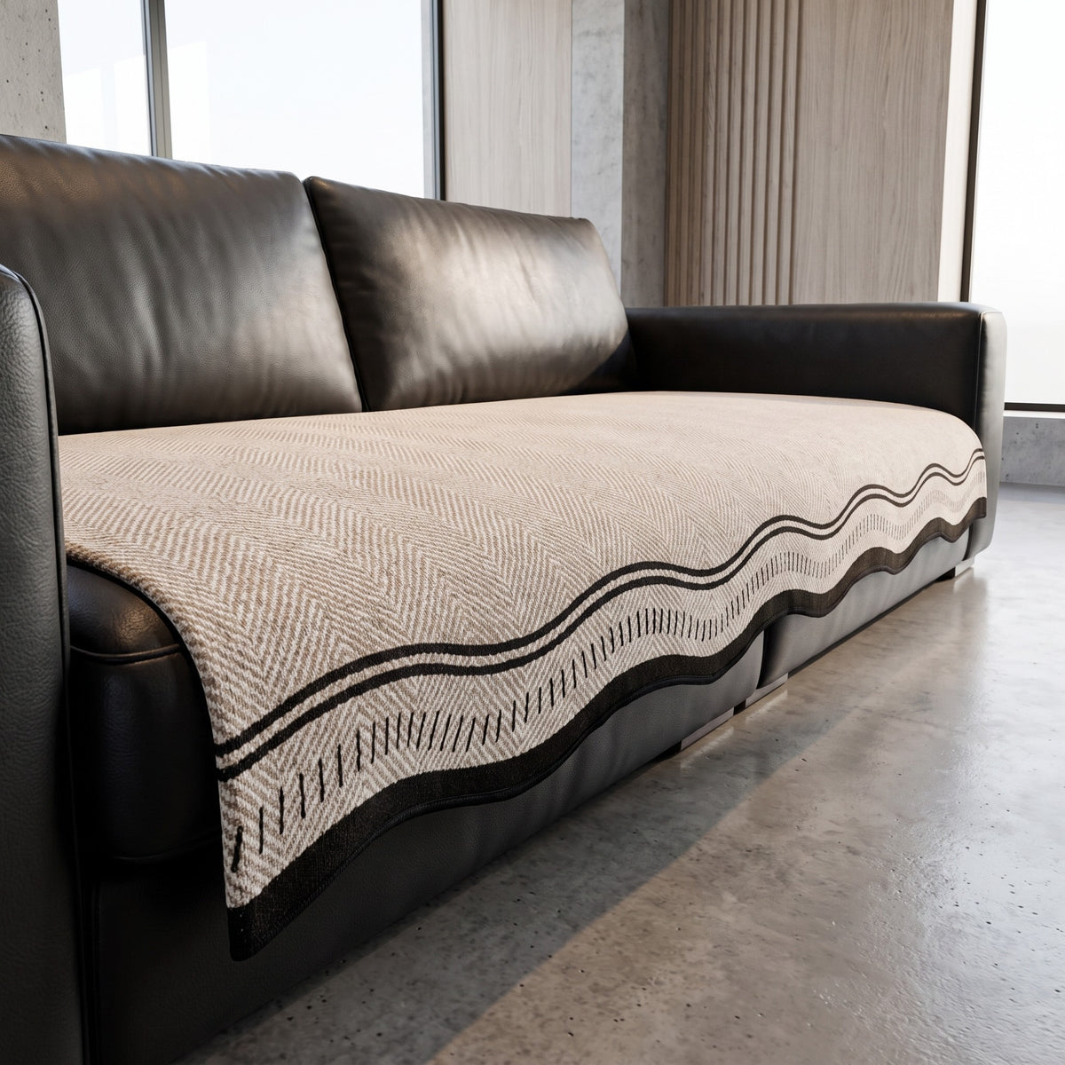 Sofa Cover in Gray on a sofa, stitched to protect edges