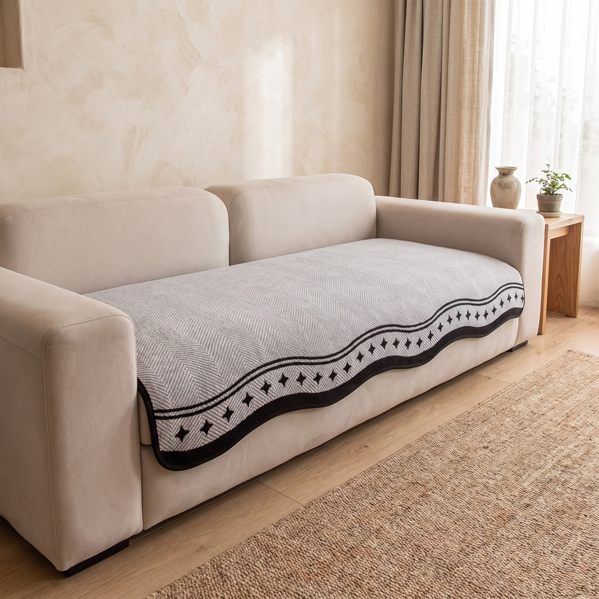Sofa Cover in Light Gray on a sofa
