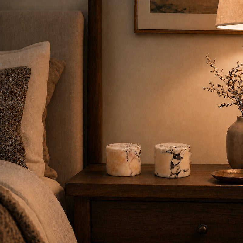 Two Ystad marble lamps on a bedroom nightstand