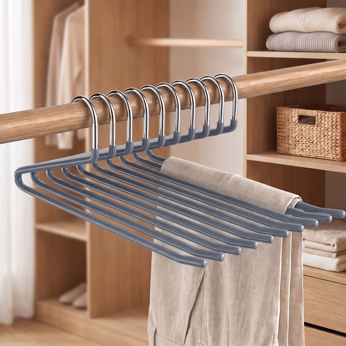 Slate Gray Z shape pants hangers on a wooden rod with linen trousers