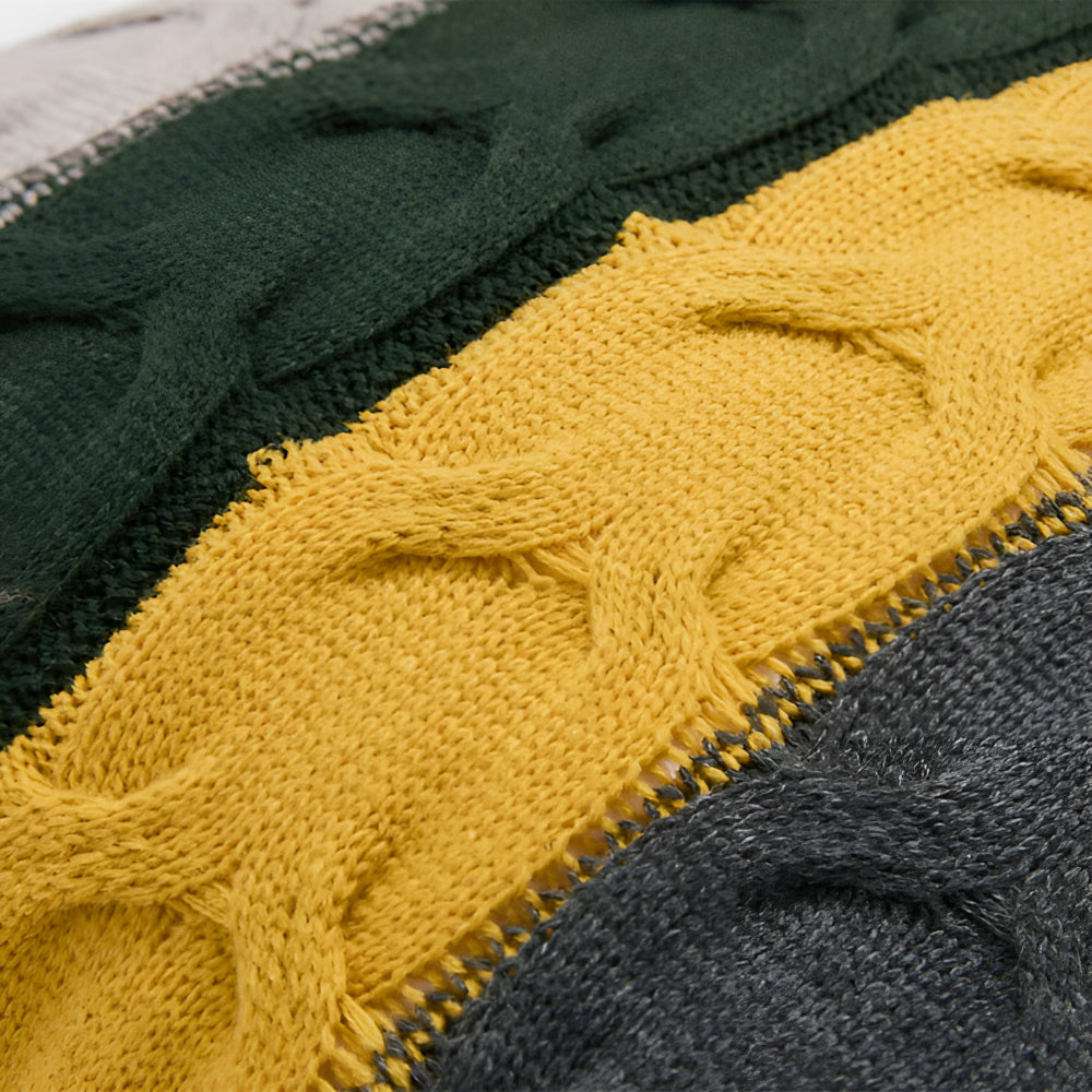 Close view of the green and mustard cable knit stripes