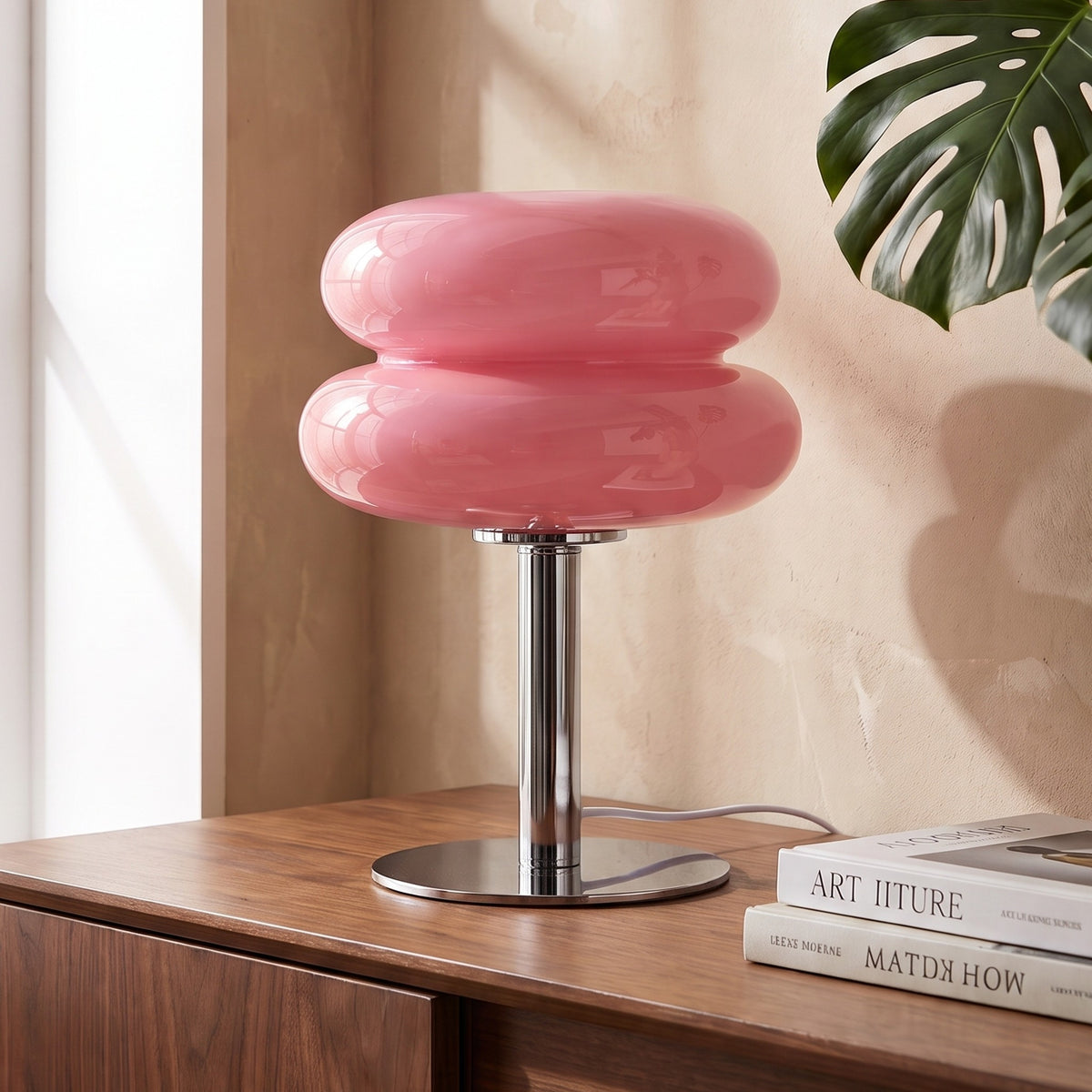 Annika glass table lamp in pink on a walnut sideboard
