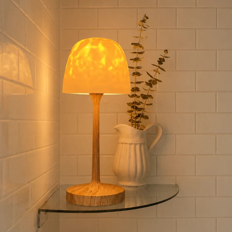 Arvika lamp with its frosted shade on a glass bathroom shelf
