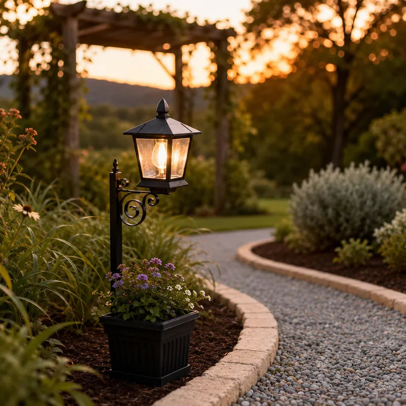 Askim lantern planter at the edge of a gravel path at sunset