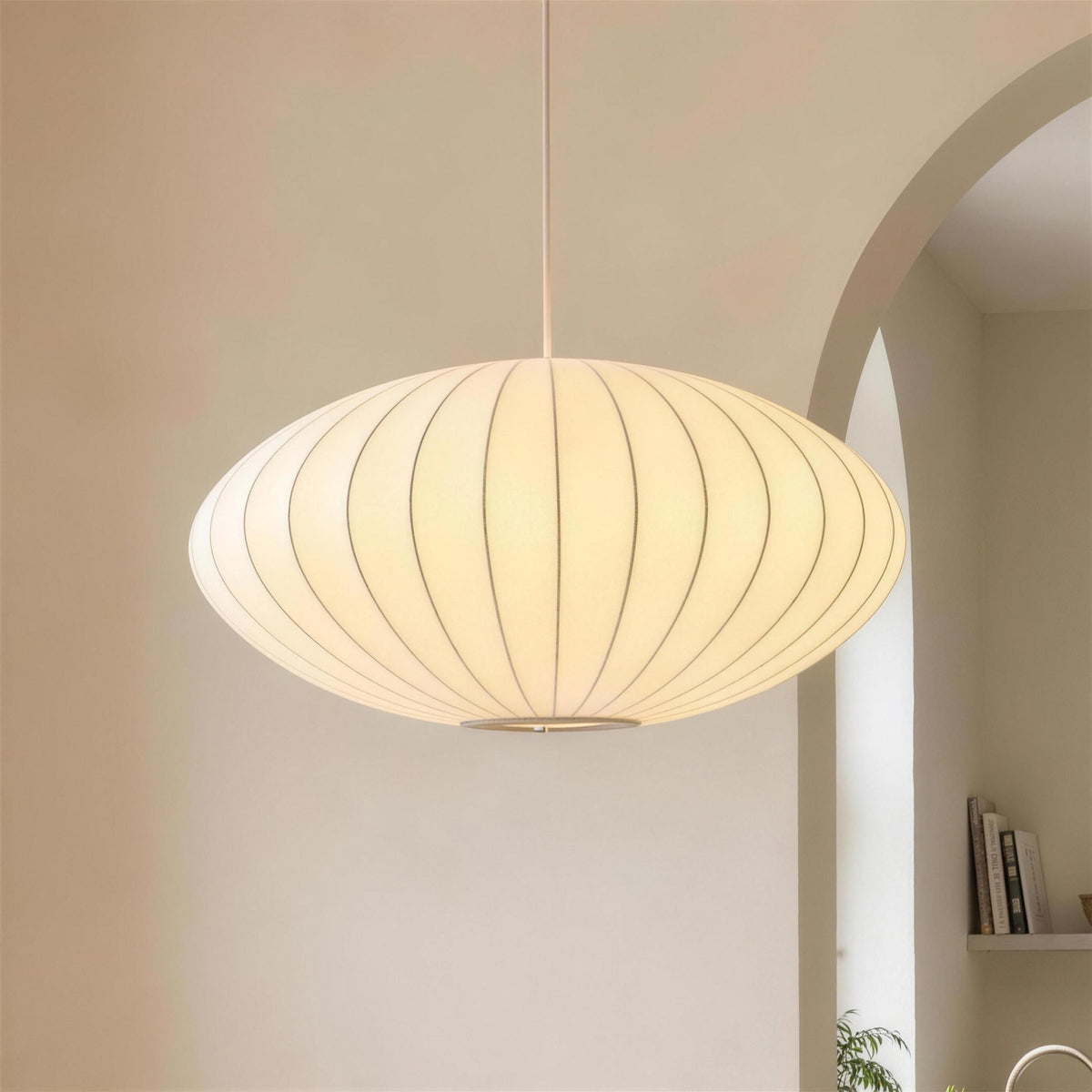 Britt pendant light, ribbed fabric saucer, 12 inch, lit over a dining table