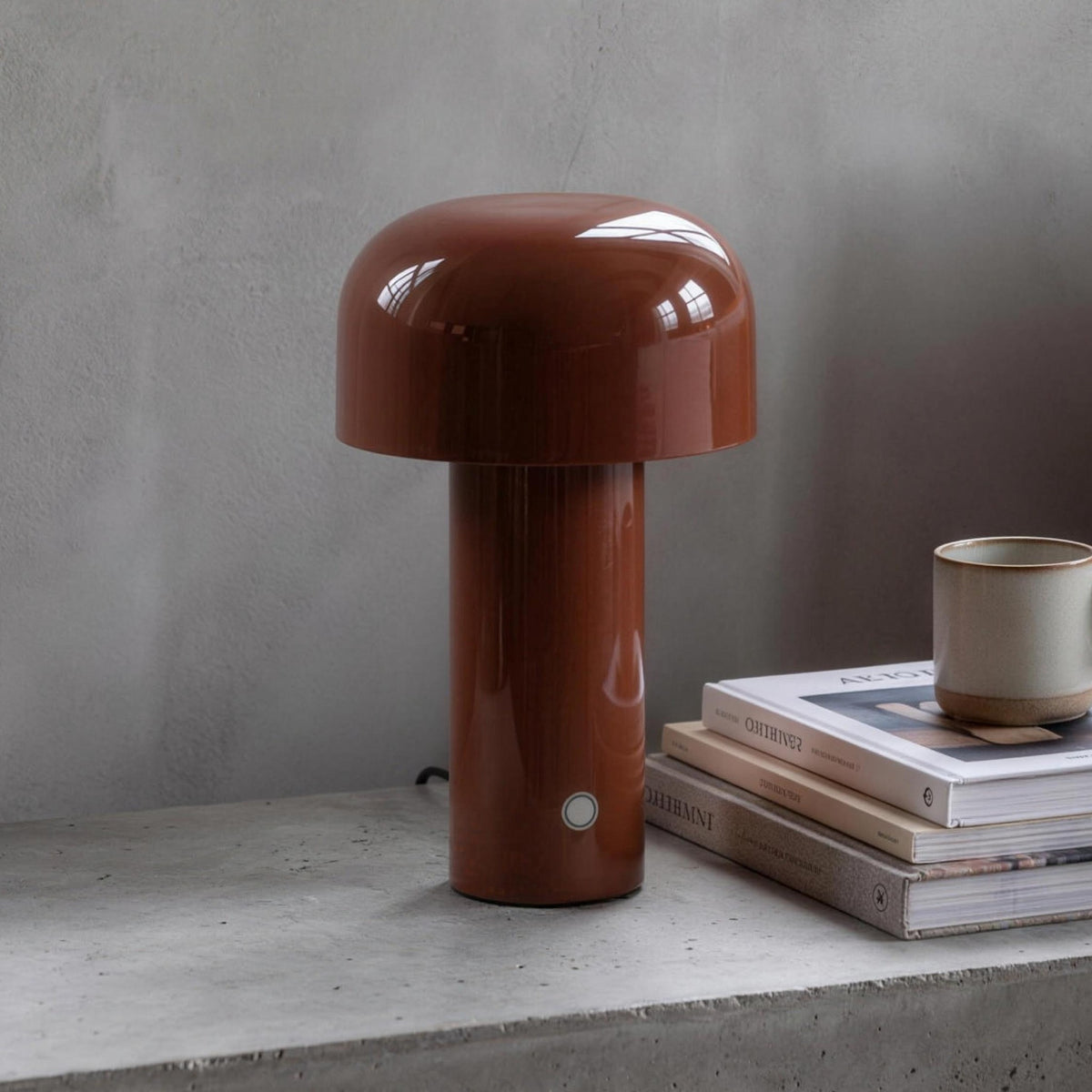 Britta dome table lamp in brown on a concrete nightstand