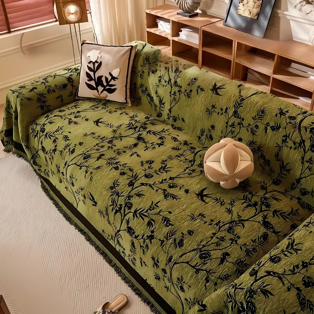 Olive green chenille sofa cover on a sofa beside wooden shelves
