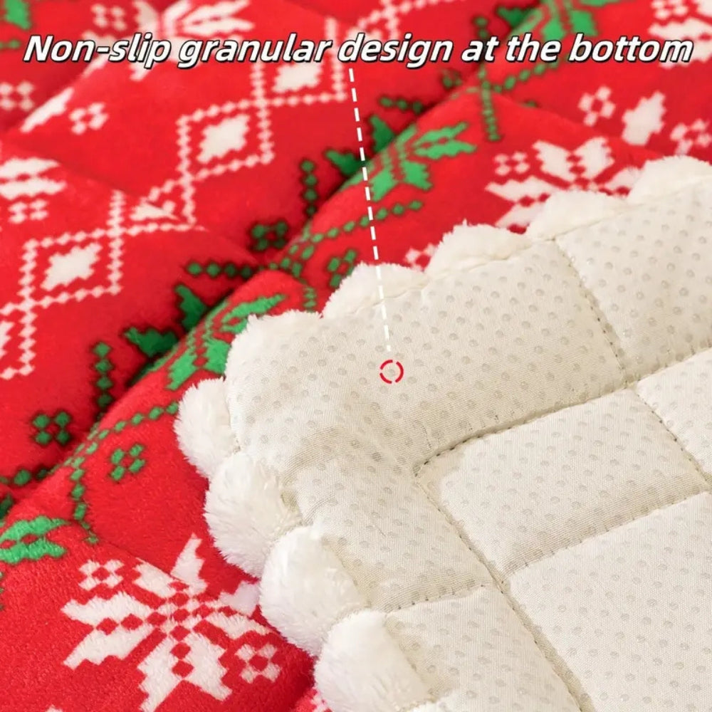 Close view of the dotted non slip back of the red holiday seat pad with a caption