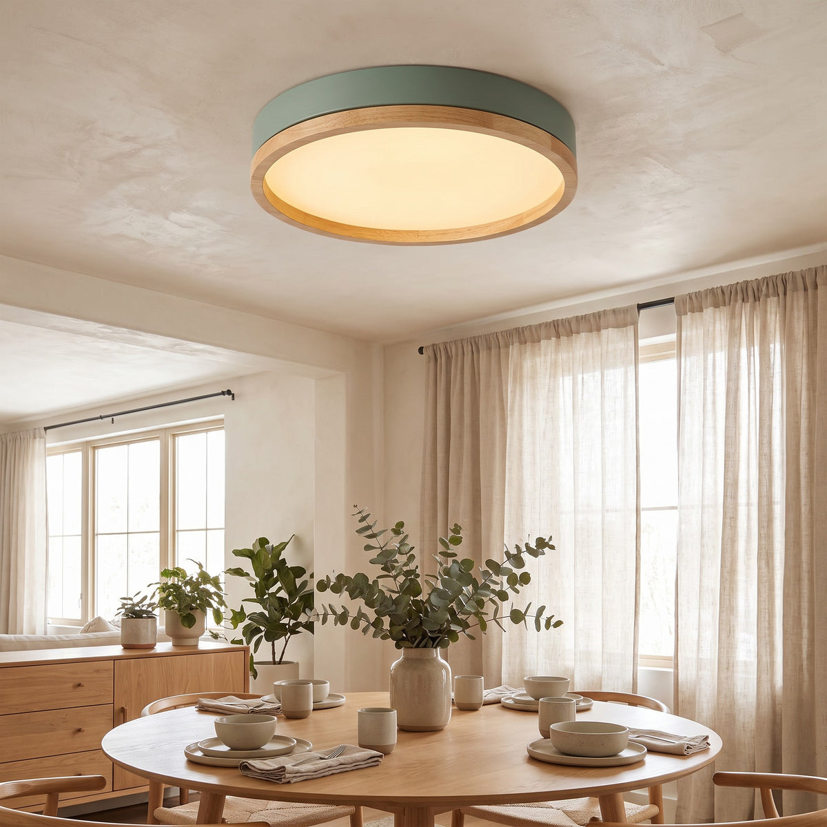 Green Eila round ceiling light above a round dining table