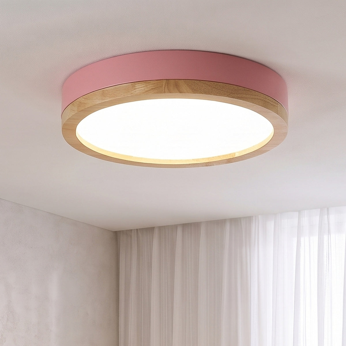Pink Eila round ceiling light lit in the same room