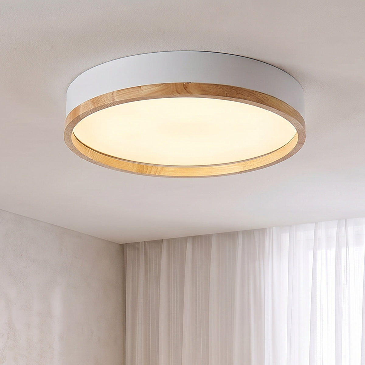 White Eila round ceiling light lit in the same room