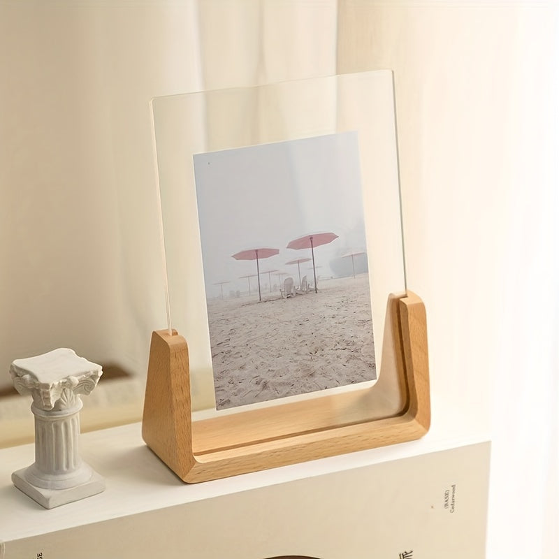 Fana beech U frame with a beach photo on a white shelf beside a small column ornament
