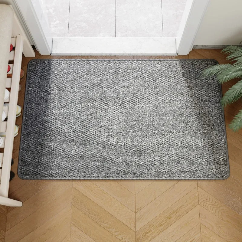 Faux jute door mat in gray inside a front door