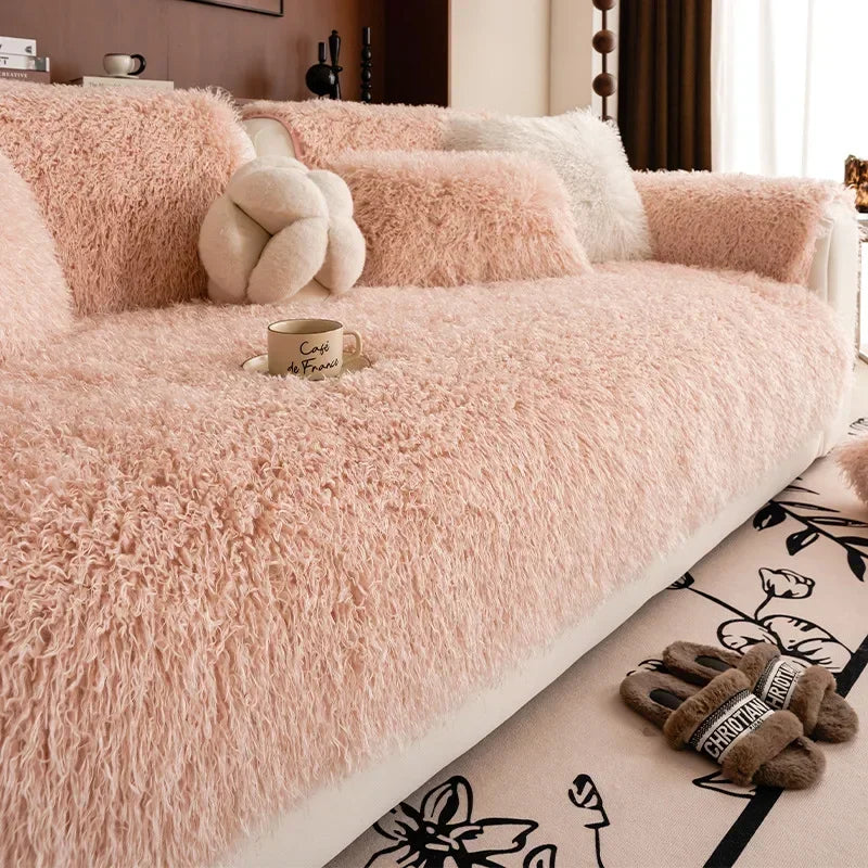 Pink faux lambswool sofa cover on a sofa