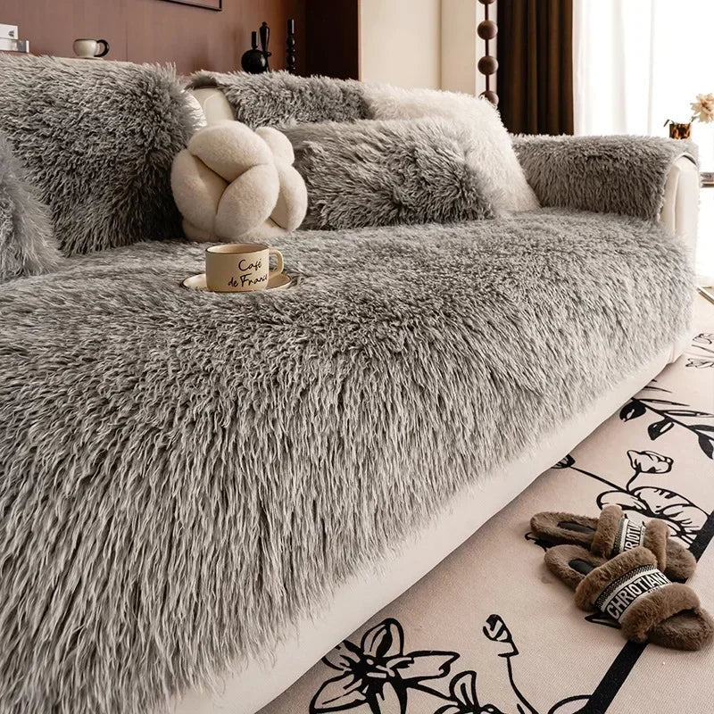 Gray faux lambswool sofa cover on a sofa