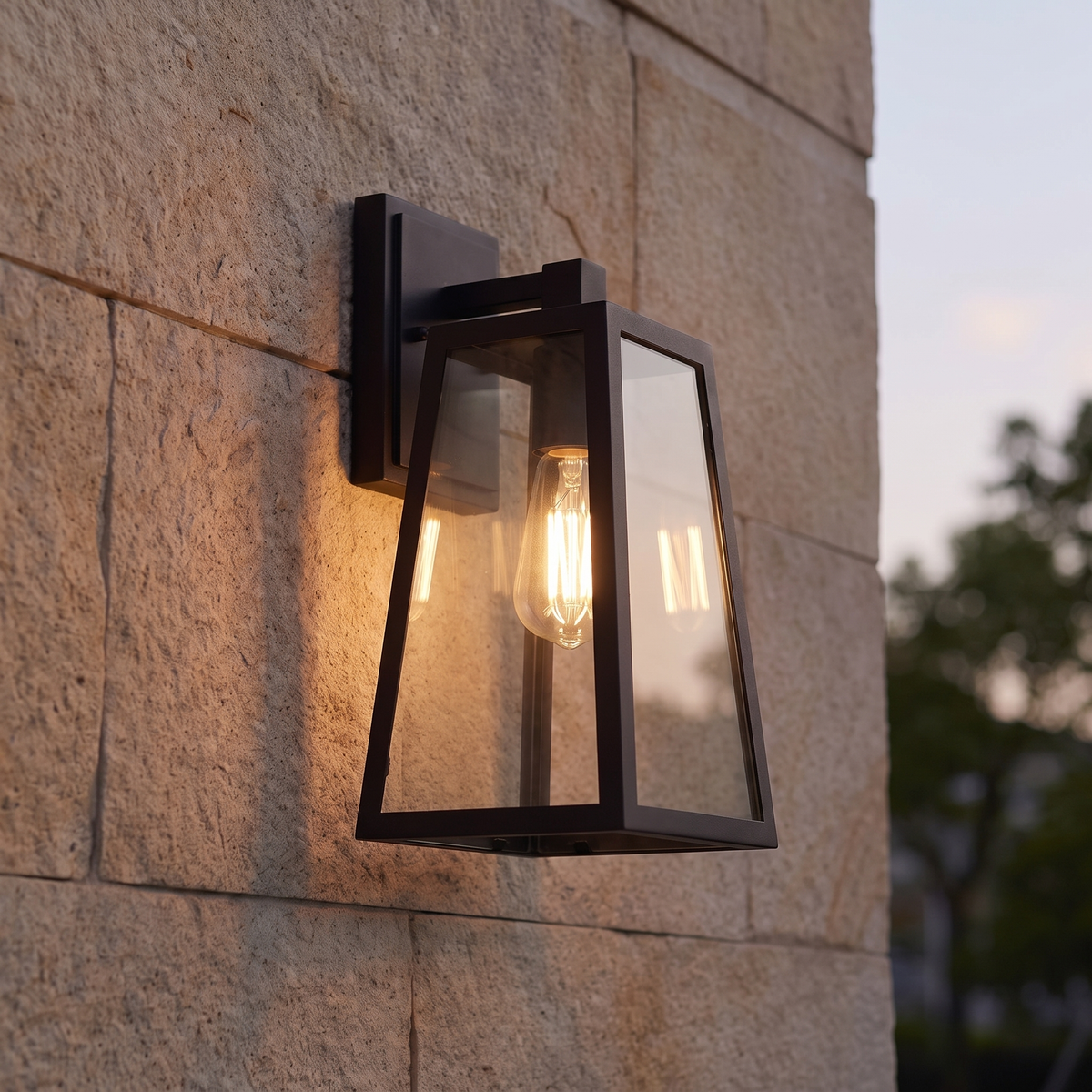 Filament bulb glowing inside the Fjell lantern's clear panels