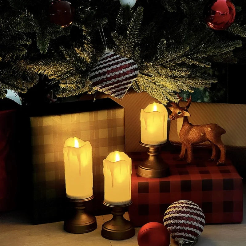 Candlestick flameless candles lit under a holiday tree