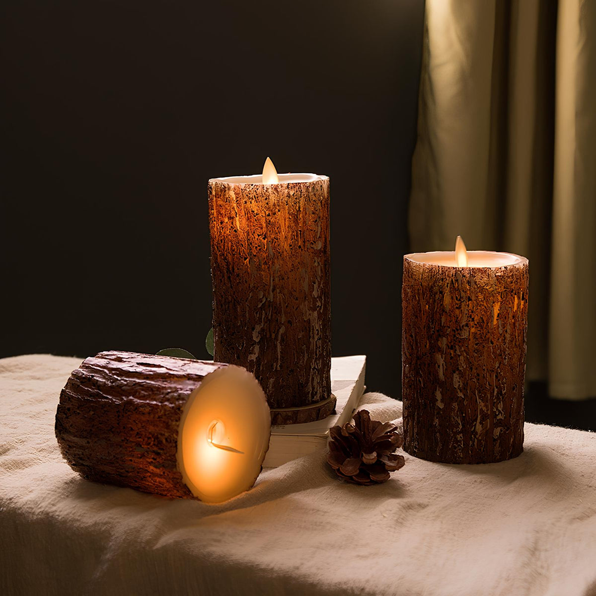 Bark finish flameless candles with one laid on its side