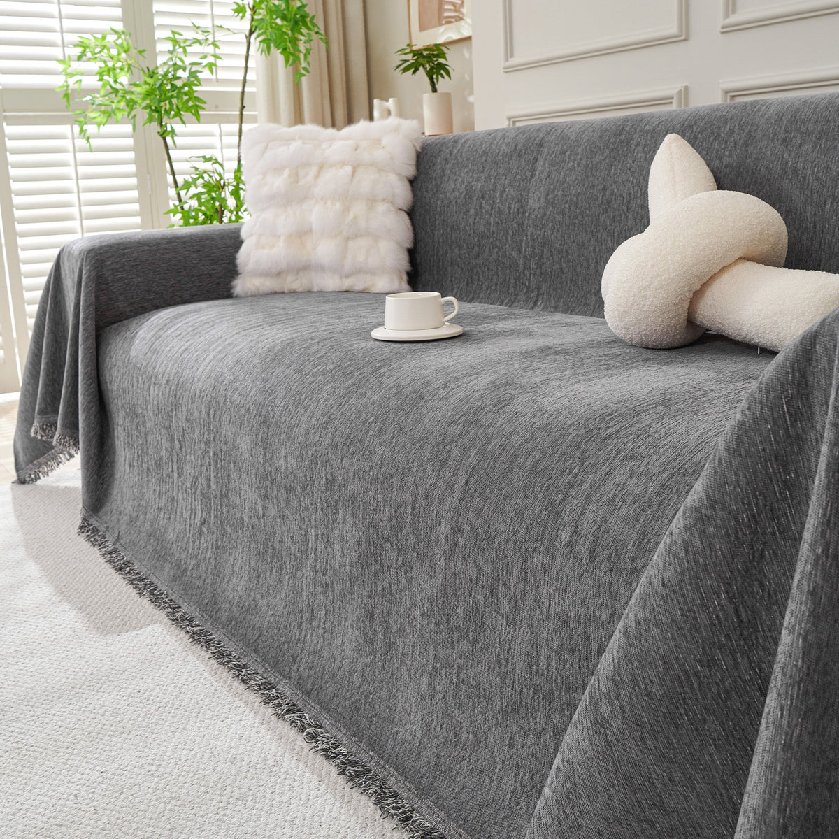Dark gray woven cover with a knot pillow