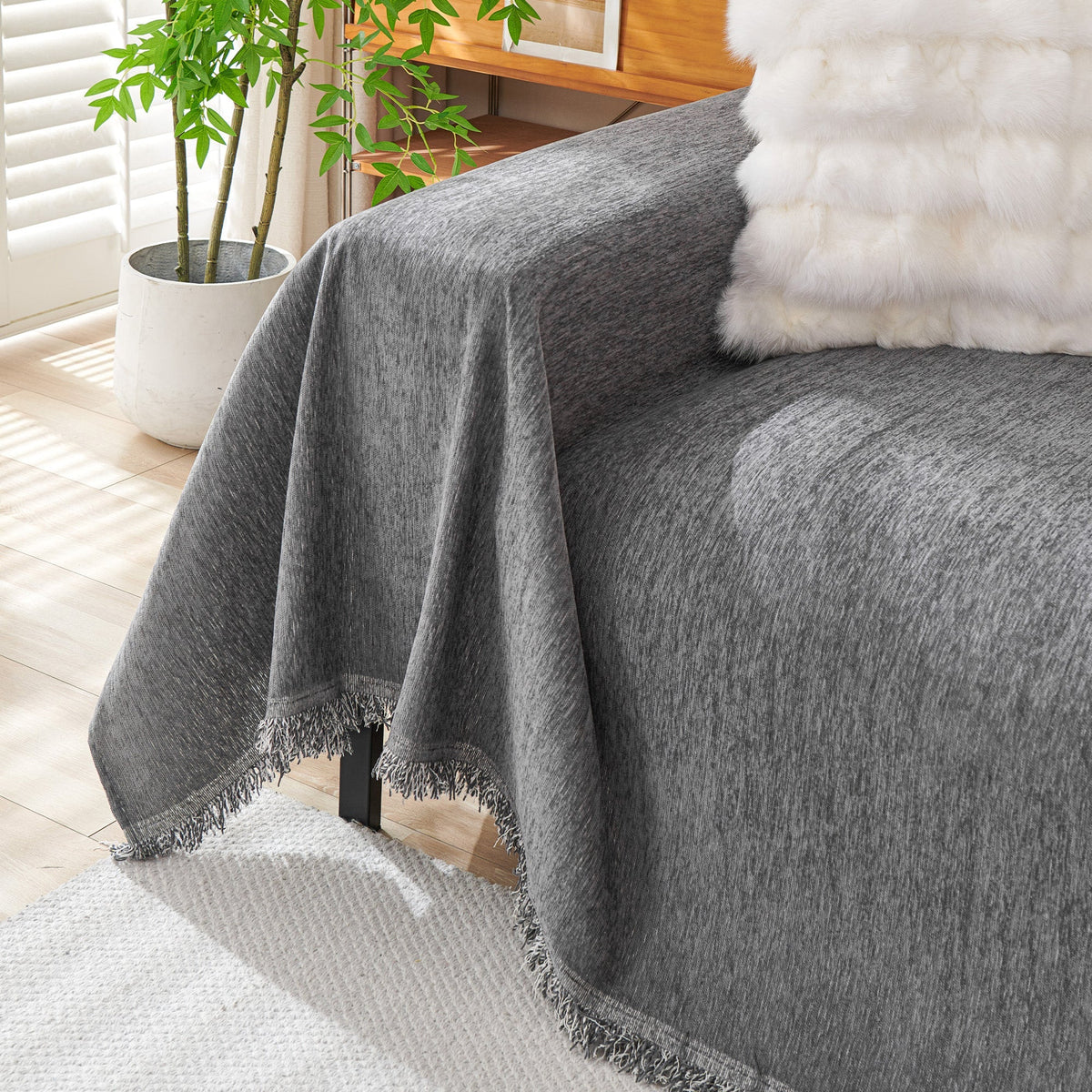 Dark gray woven cover over a sofa arm