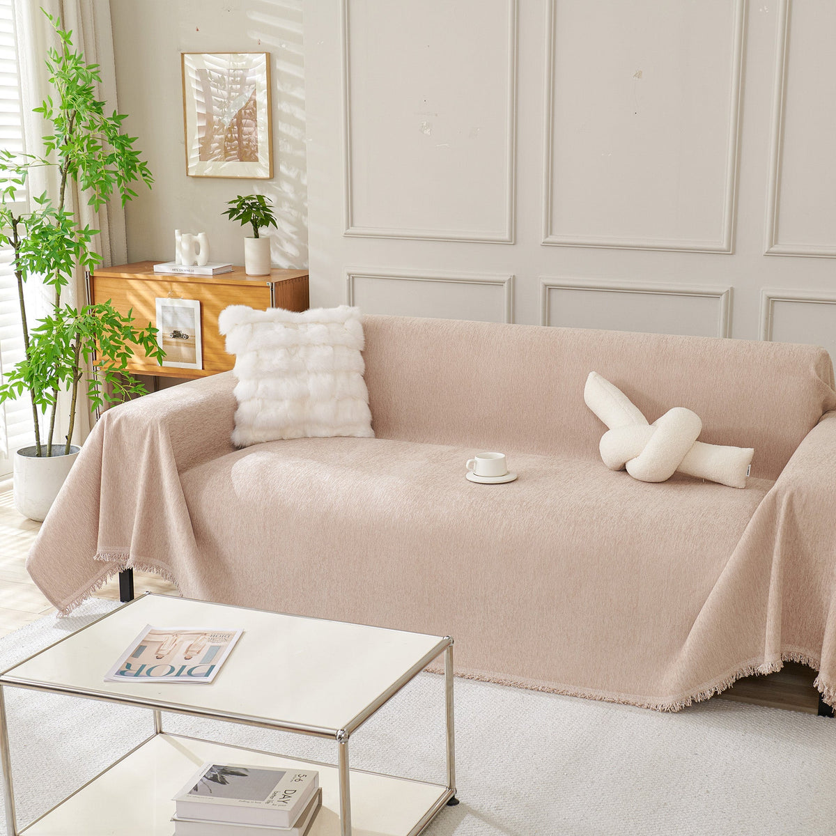 Blush pink woven cover by a coffee table
