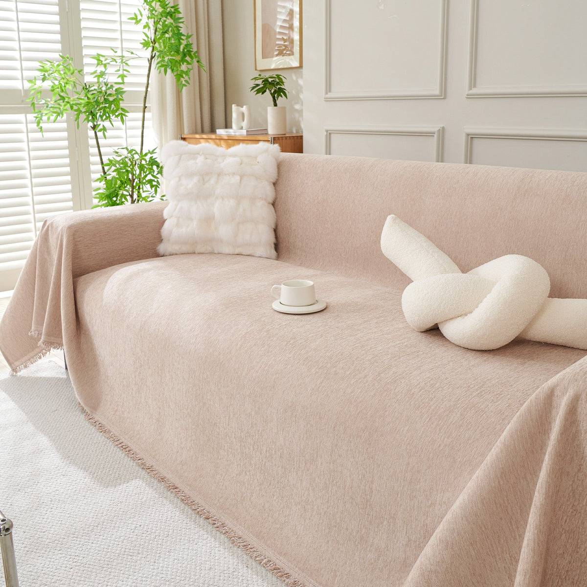 Blush pink woven cover with a knot pillow
