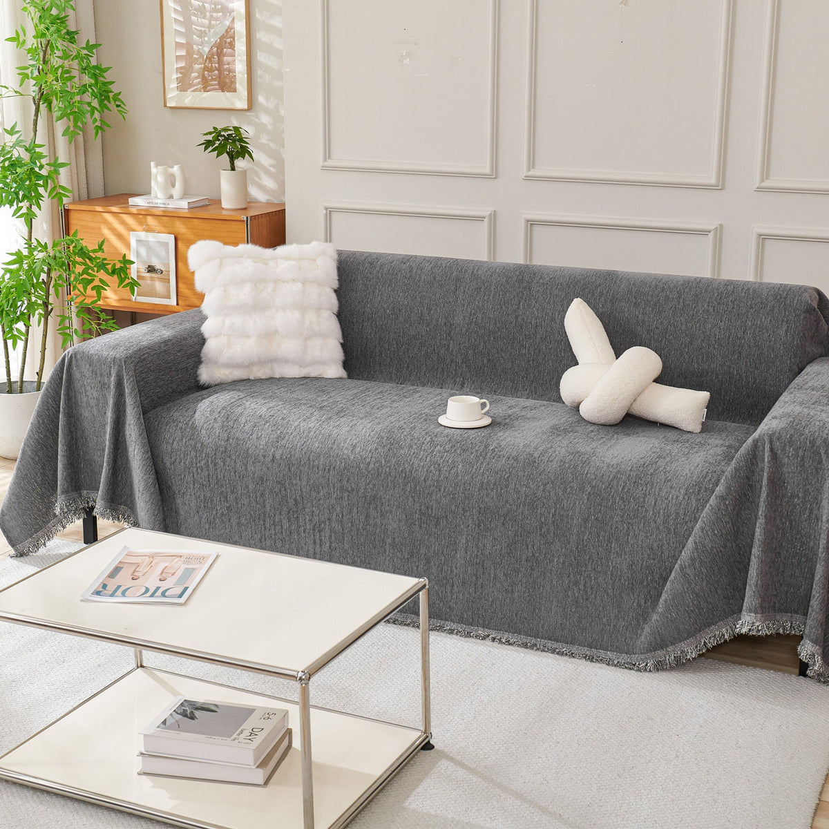 Dark gray woven sofa cover over a sofa