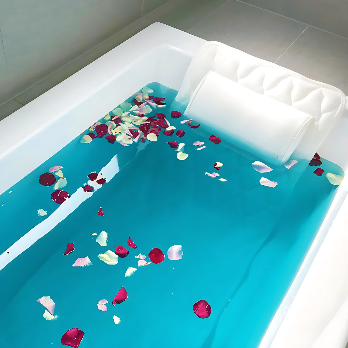 Full body bath pillow in a bath with rose petals