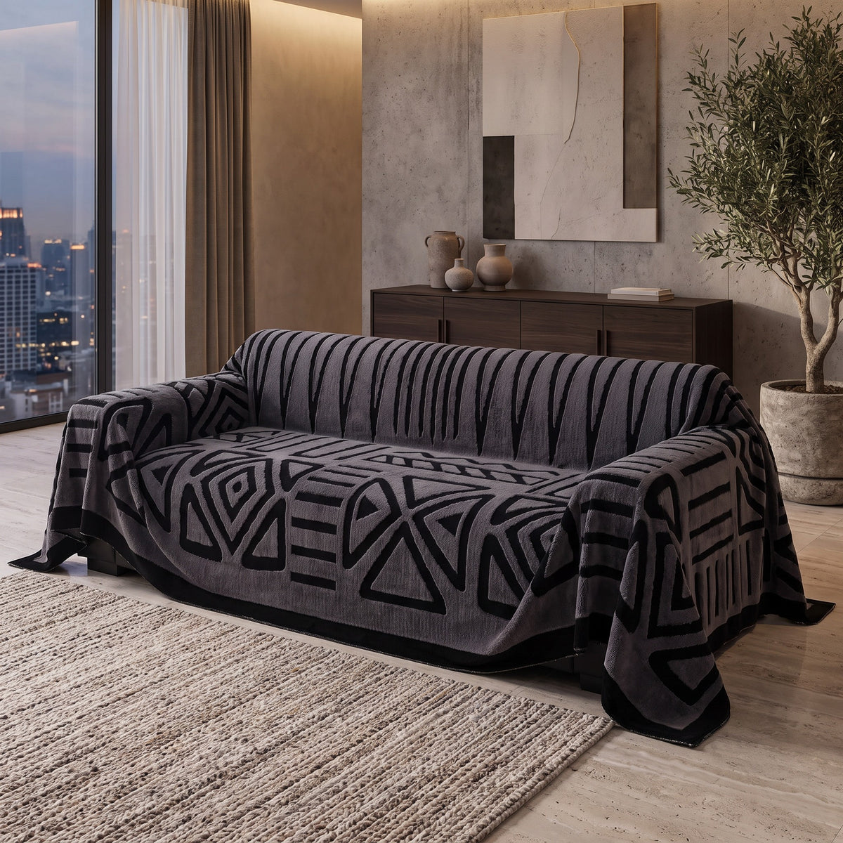 Sofa Cover in Charcoal on a sofa in a living room