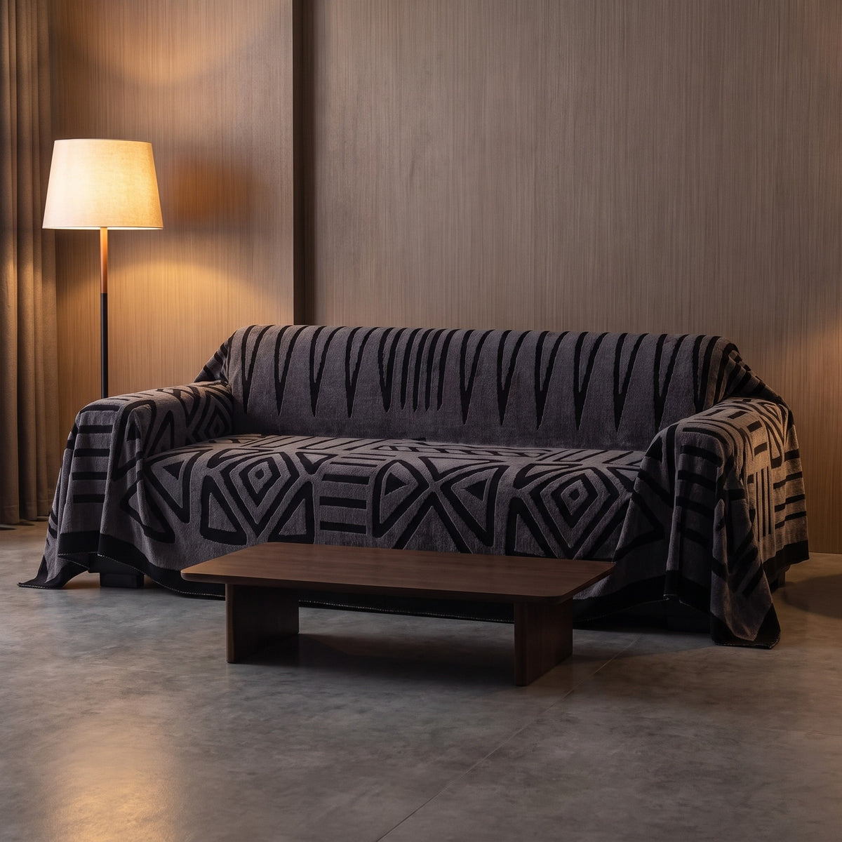 Sofa Cover in Charcoal on a sofa in a lived in room