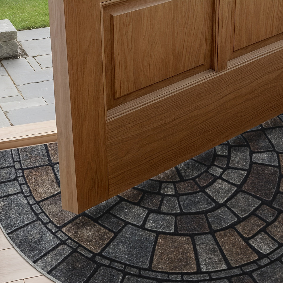 Half round mosaic door mat at an open wood front door