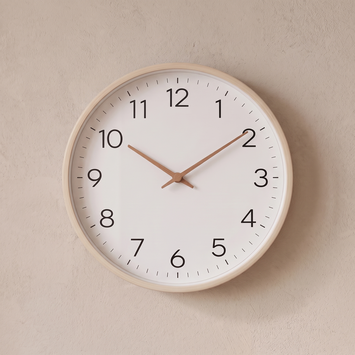Hamar wall clock with a cream wood frame on a plaster wall