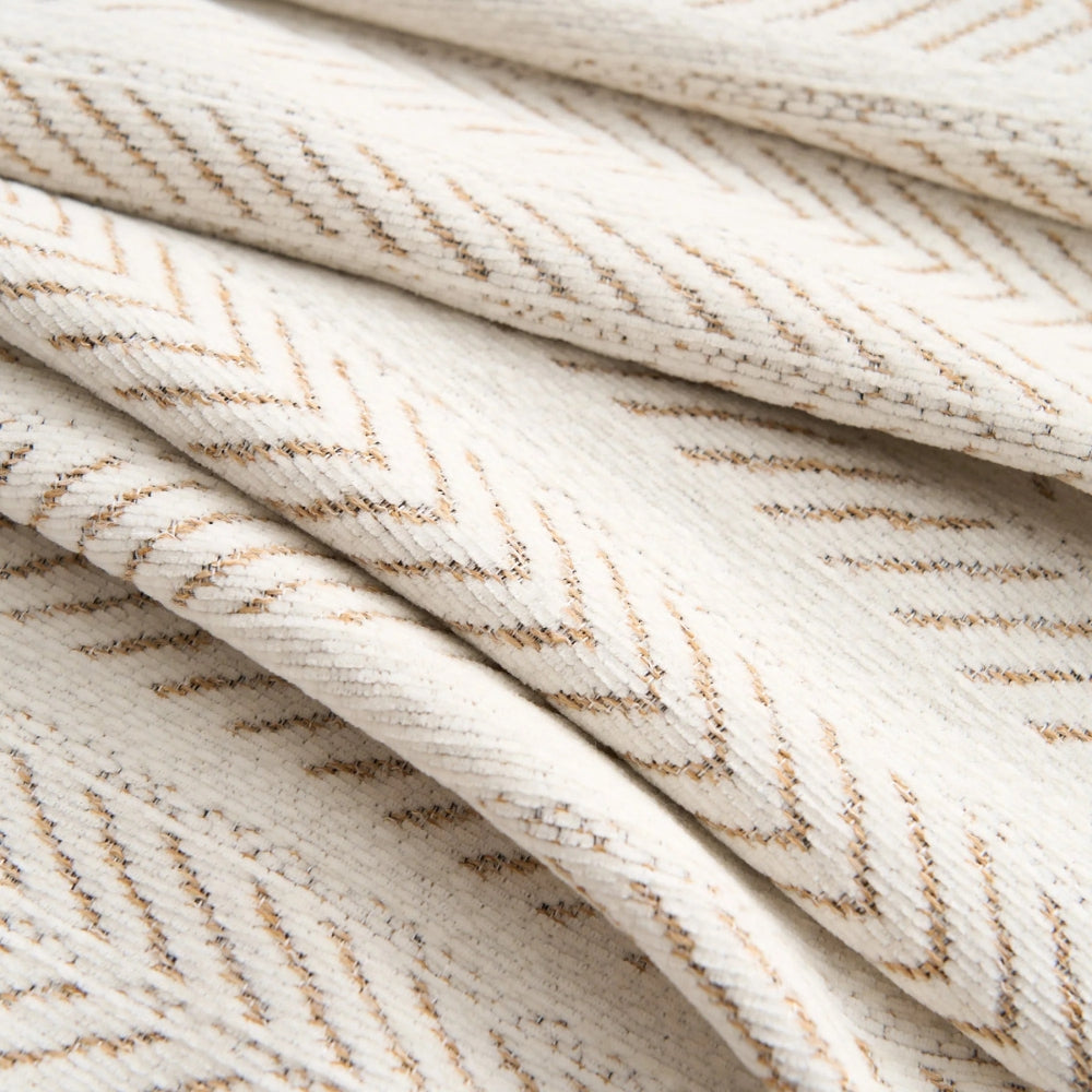 Close view of the folds of the beige herringbone chenille weave