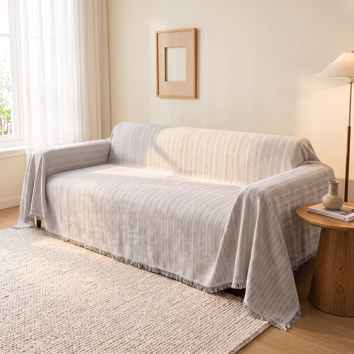 Sofa Cover in Light Gray on a sofa