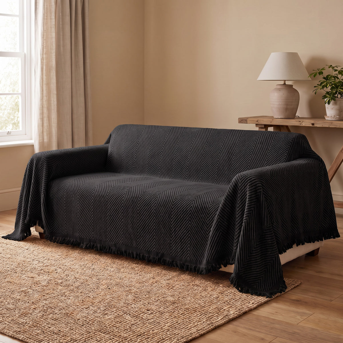 Couch Cover in Black on a sofa