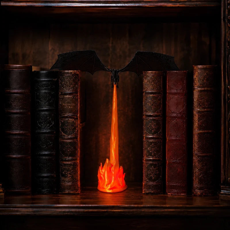 Holte dragon night light glowing between leather bound books
