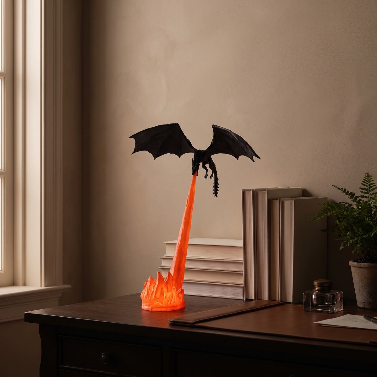 Holte dragon night light on a desk in a dim study