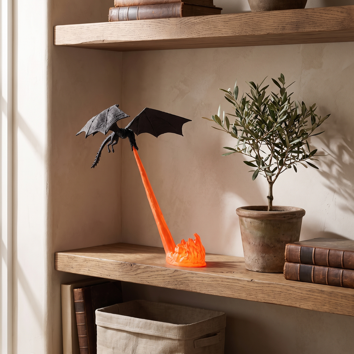 Holte dragon night light on an open shelf beside a plant