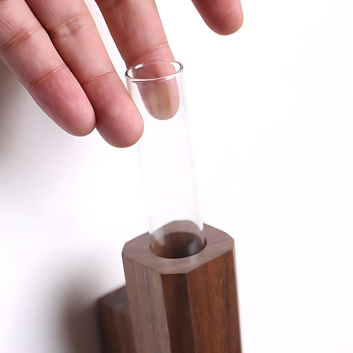 Glass tube sliding into the Idun walnut wall vase