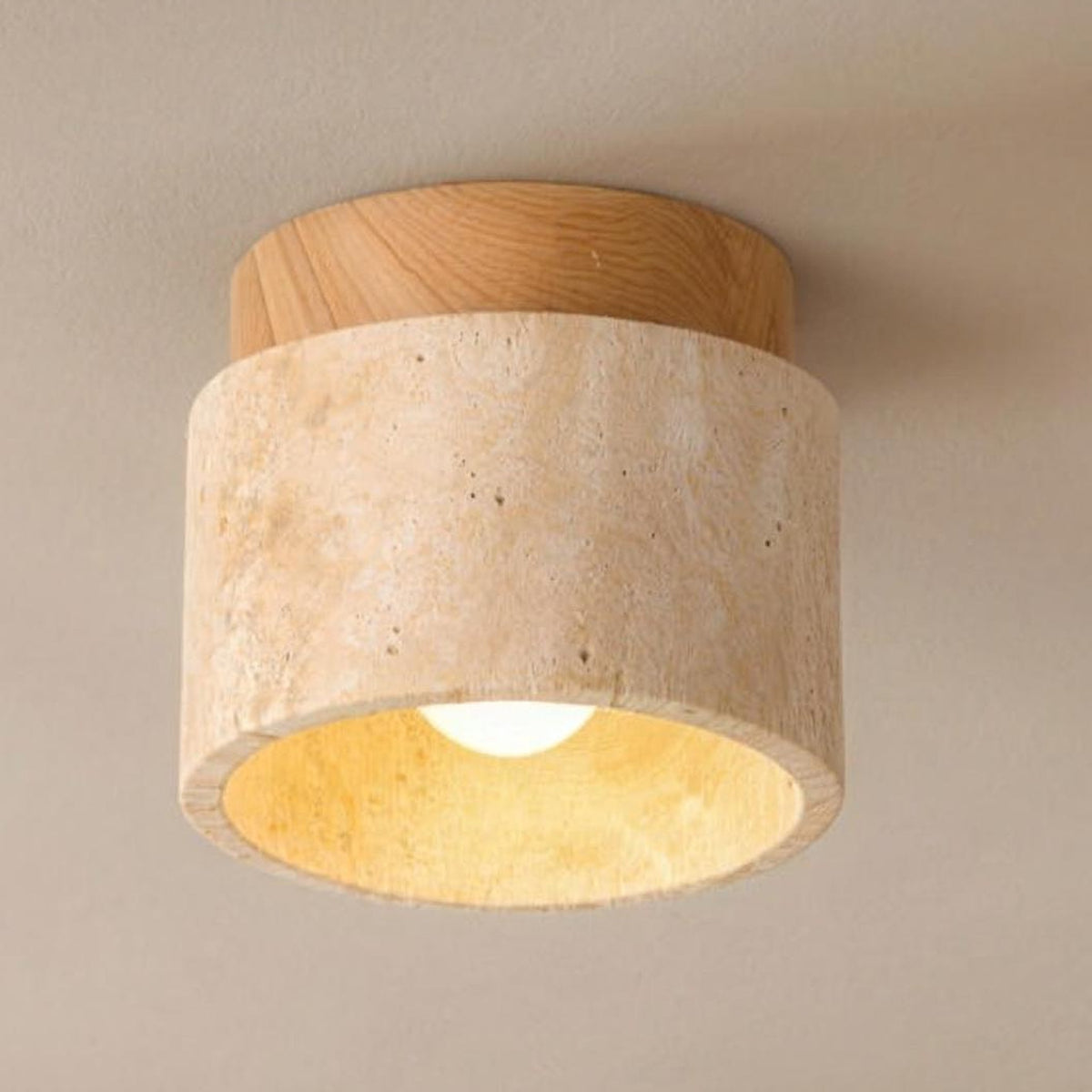 Jonna ceiling light, travertine drum with a natural wood trim, lit