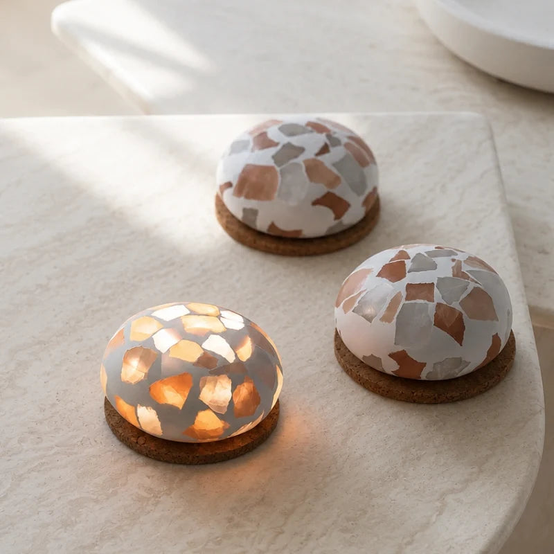 Three Kvist dome lights in Terrazzo on a pale table